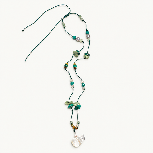 Clear Stream — Crystal Drift Necklace on ivory background